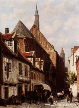 Una calle muy transitada en Bremen con la iglesia de Saint Johan