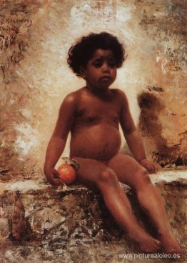 Niño árabe con una naranja